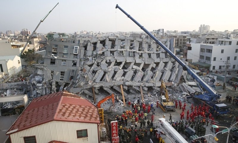 collapsed apartment building in Taina