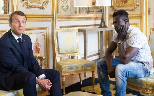 Macron receiving Gassama at the presidential palace