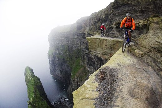 Cycling at the Cliffs of Moher Hans Rey and Steve Peat