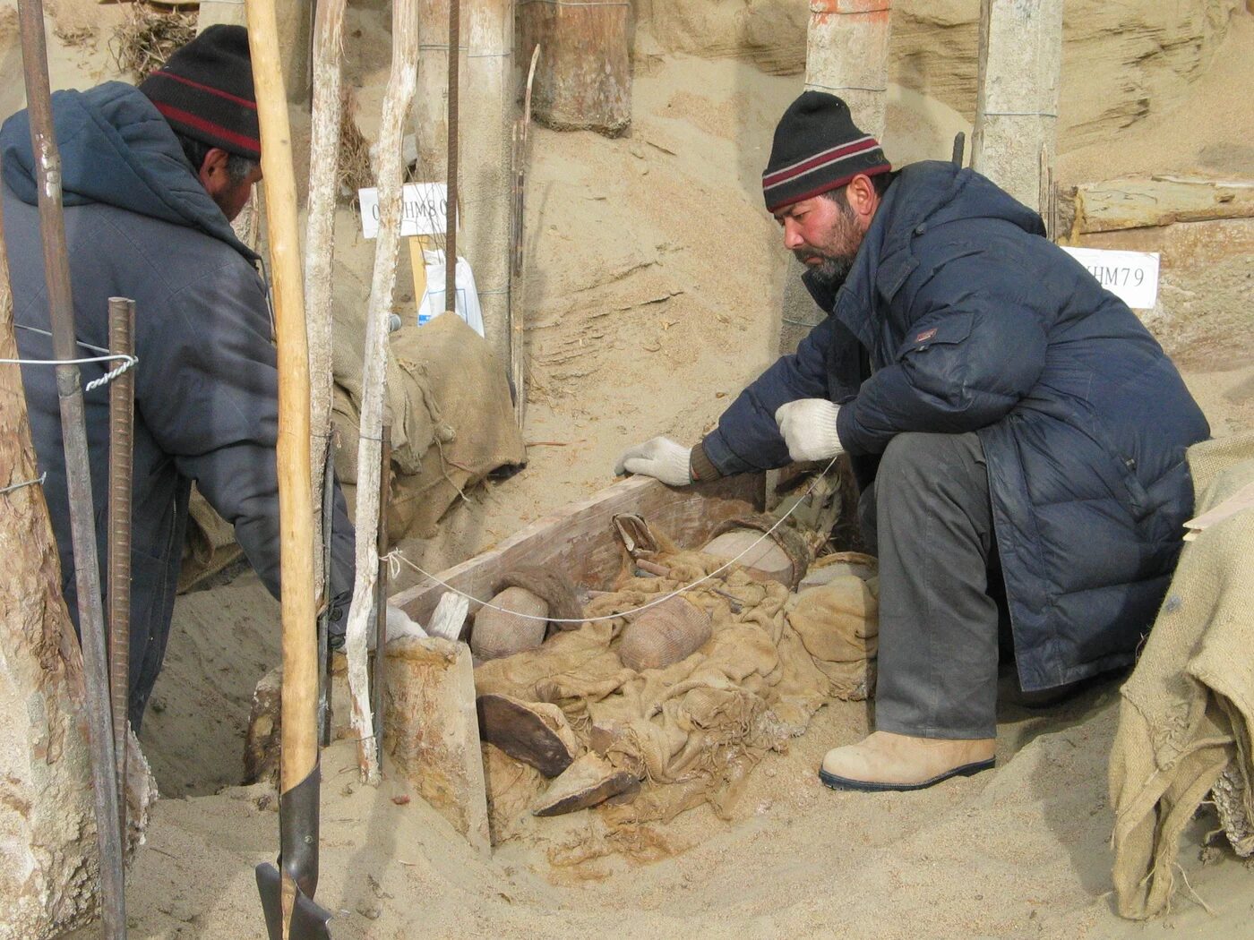 Excavation of burial M75 at the Xiaohe cemetery.