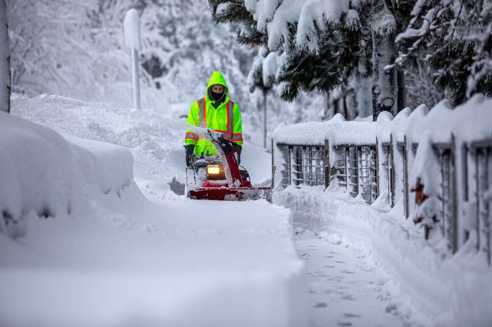 Local crews use snowblowers and plows to remove snow off the sidewalks in Tahoe City.