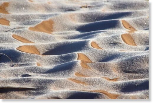 The ice created stunning patterns in the sand