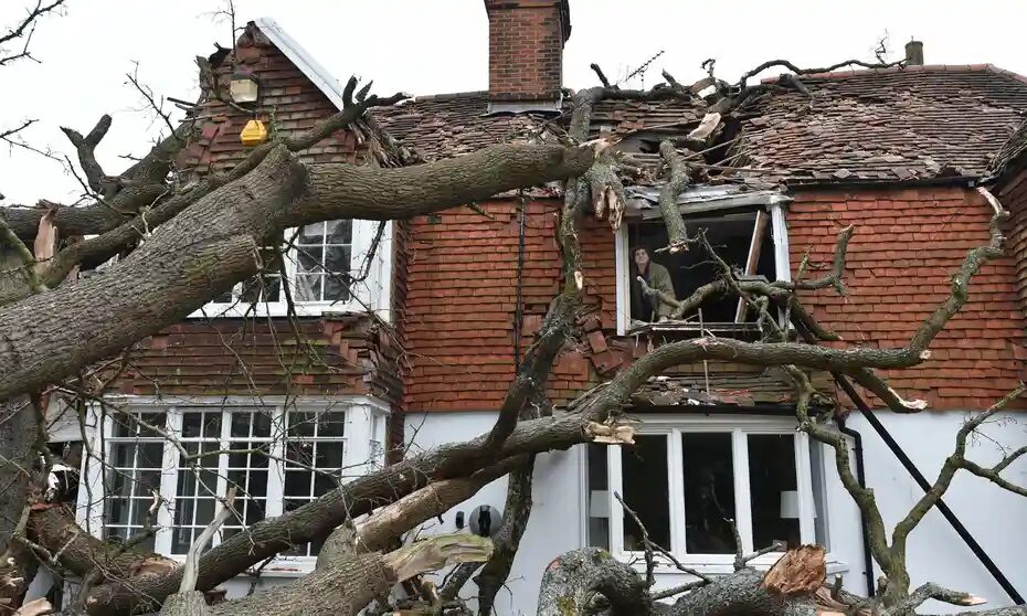 The Good family’s home in Stondon Massey, near Brentwood, Essex, after a 400-year-old oak tree in the garden was uprooted by Storm Eunice.