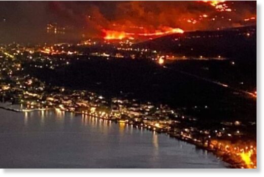 The resort town of Itea, central Greece, has been encircled by the wildfire.