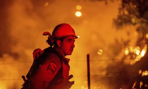 Rafael Soto battles the Electra fire burning in the Rich Gulch community of Calaveras County, California, on Tuesday.