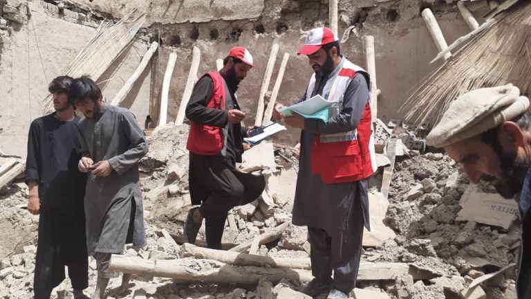Afghan Red Crescent workers and volunteers surveying families affected by recent floods in Gardez, capital of Paktia province, July 2022.