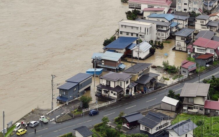 Houses are flooded in the town of Oe in Yamagata Prefecture on Thursday