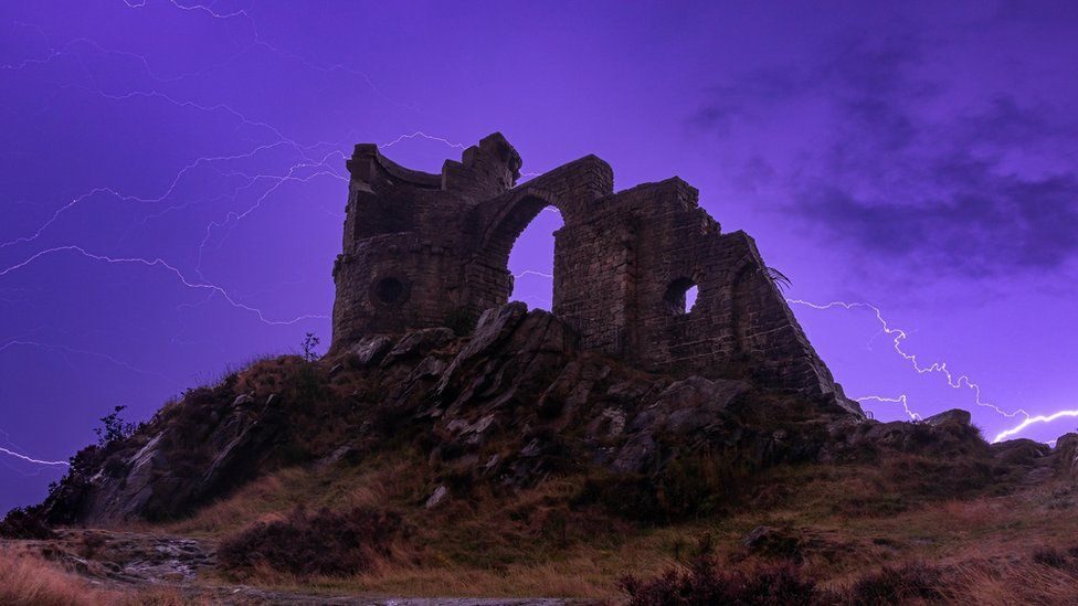 Lightning pictured above Mow Cop in Staffordshire