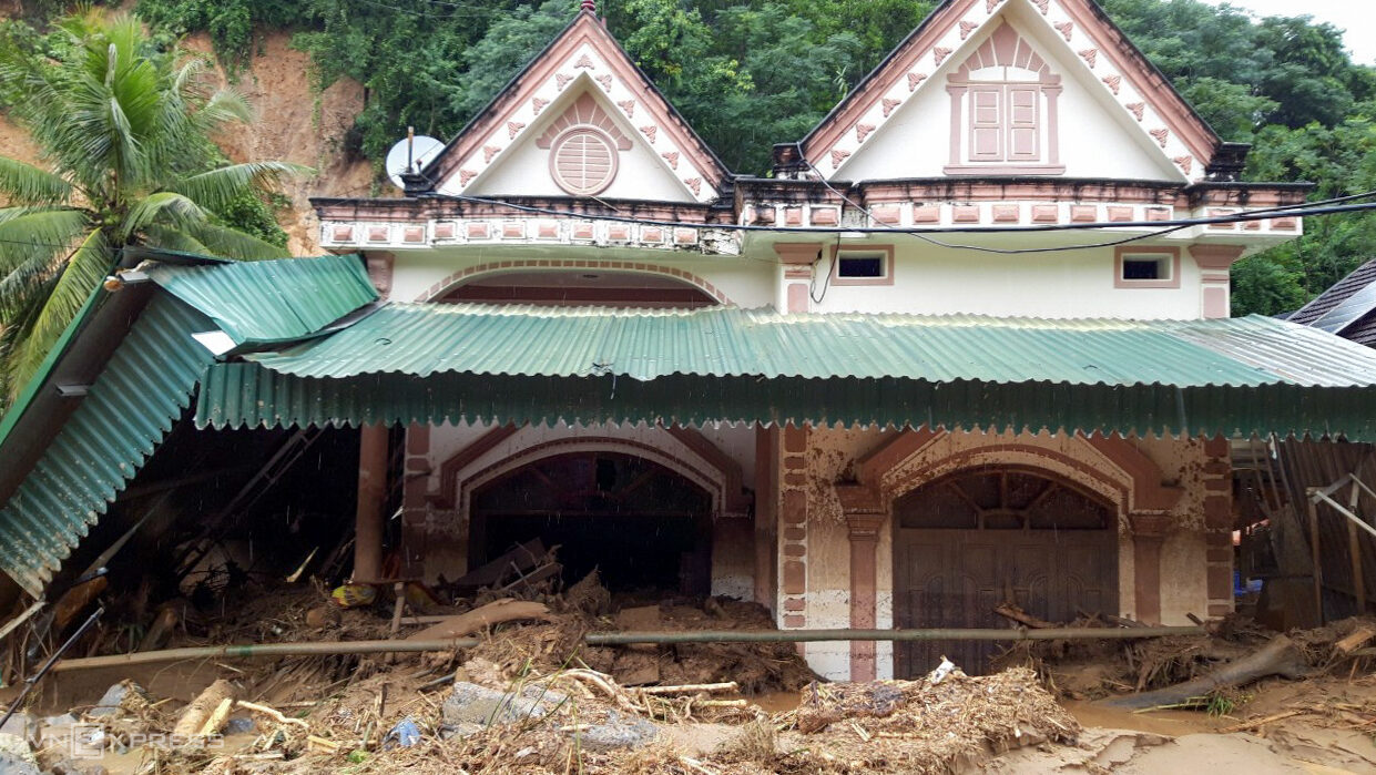 Several other houses like the one above were filled with mud and wreckage deposited at their front doors.