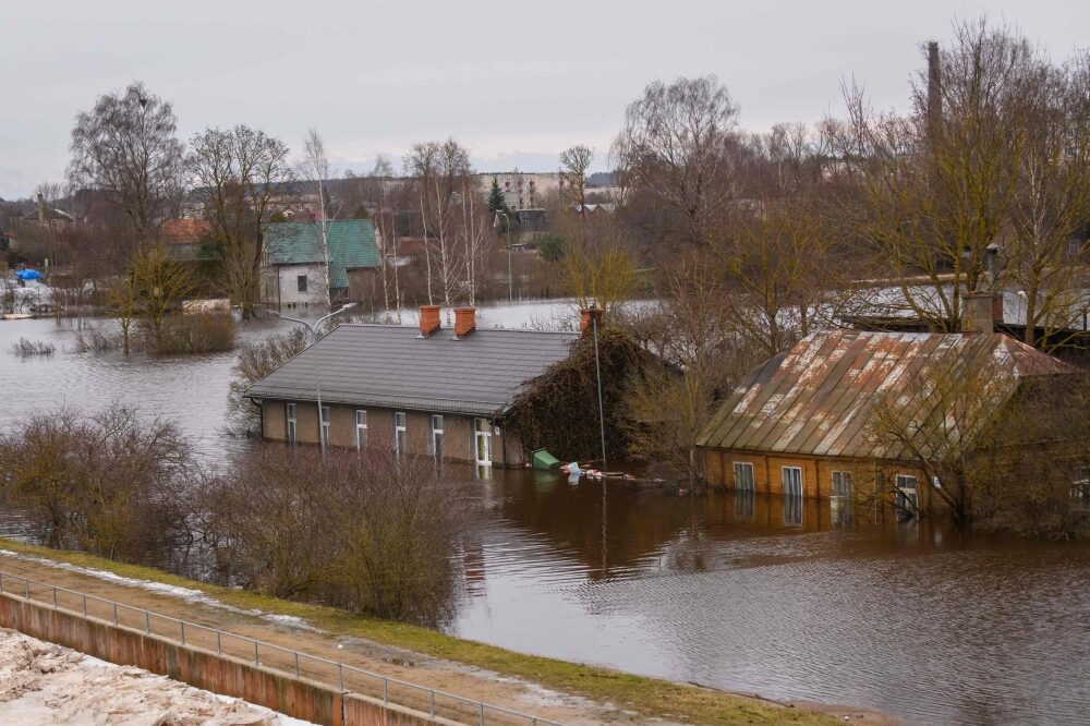 Flooded houses are pictured in Jekabpils, Latvia, on January 15, 2023.