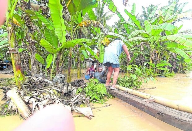 Residents return to their flooded communities in President Roxas, Cotabato,