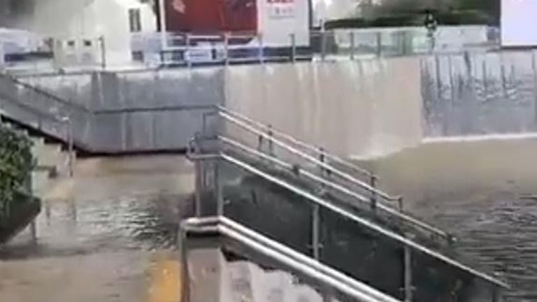 Wuxi East railway station in eastern China has been hit by flooding, with water seen cascading down the stairs.