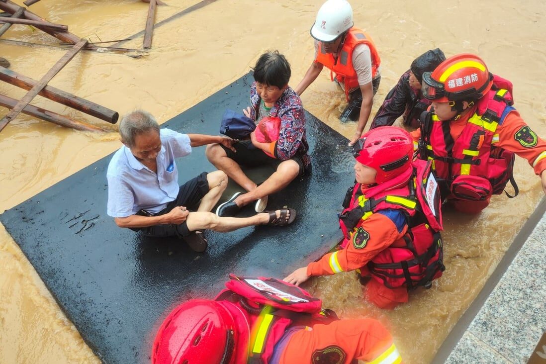 Firefighters evacuate residents after Typhoon Do