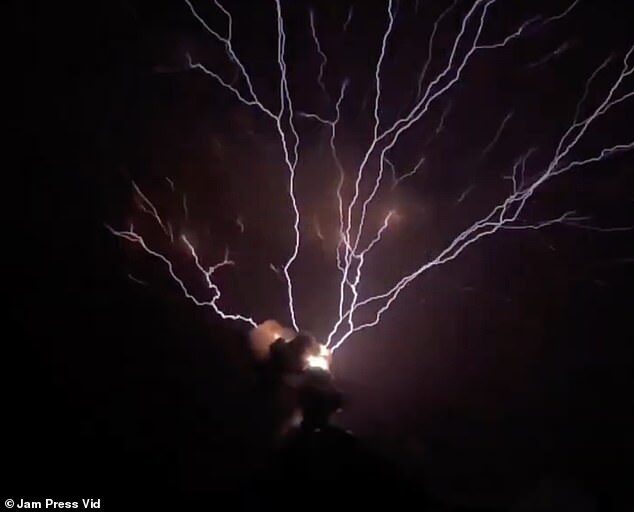 The incredible moment lightning strikes hit an erupting volcano has been captured