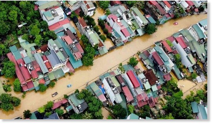 Flood waters submerged buildings after heavy rain in Ha Giang city in northern Vietnam on June 10, 2024.