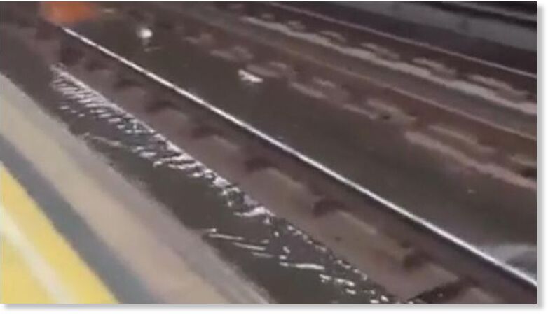The metro tracks flooded, with water seen dripping from the ceiling
