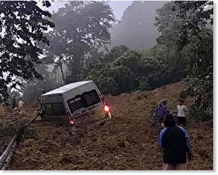 A 16-seater van is buried in a landslide in Bac Me District of Ha Giang, July 13, 2024.
