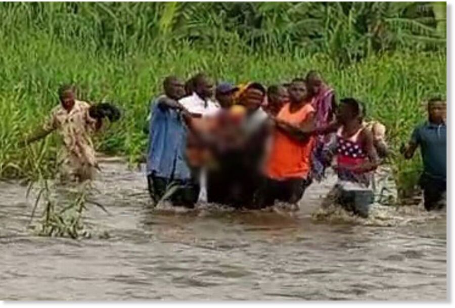 Residents of Kibandama I Village in Kilembe Sub-County, Busongora County South, Kasese District retrieve the body of Harriet Muzawimana from the river on Wednesday.