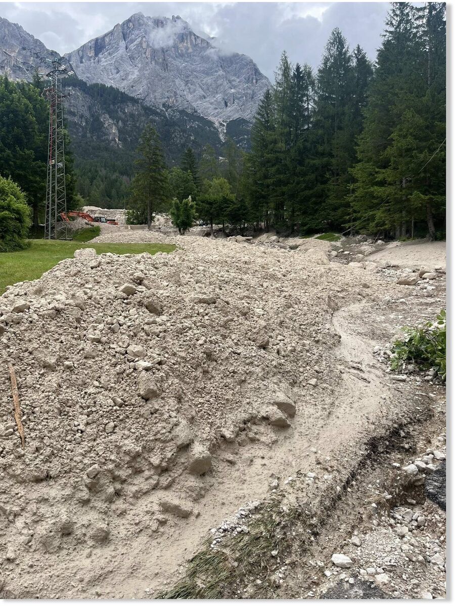 Tons of rock and debris spilled down the mountain and trapped 10 people inside their homes.