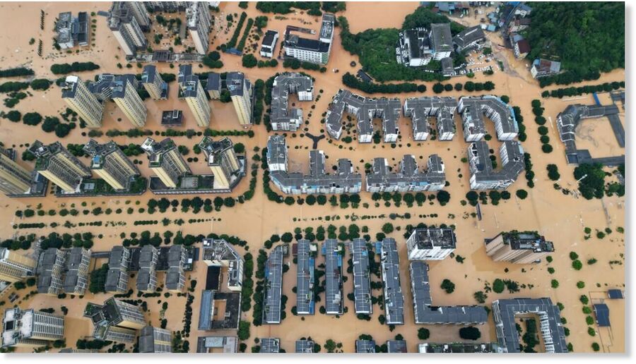 An aerial photo shows flooded buildings in Rongjiang, in China's southwest Guizhou province on June 24, 2025