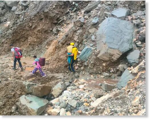Passengers are being evacuated on foot near Silai Band on Yamunotri Highway