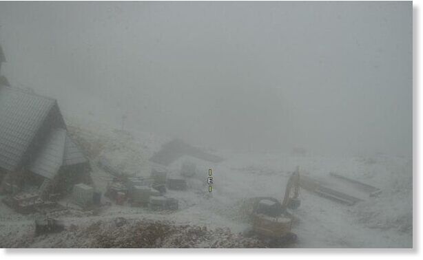 Snow falls at the peak of summer in Kredarica, Slovenia  Snow has fallen in the mountainous region of Kredarica in Slovenia