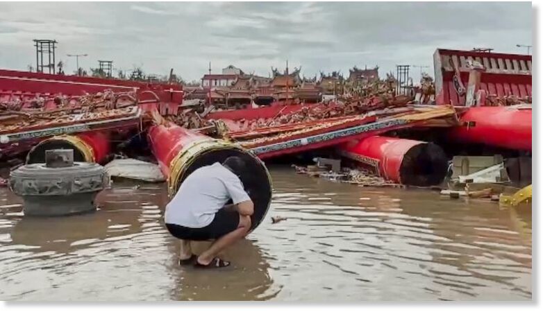 The structure of a temple's gate collapsed in Tainan. Pic: TVBS/AP