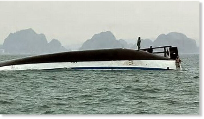 the capsized tourist boat during a search operation in Ha Long Bay, Quang Ninh province