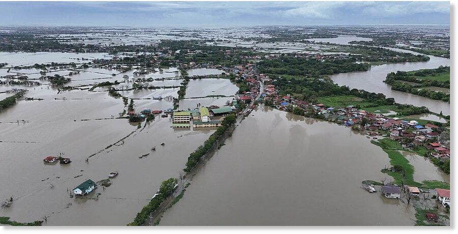 An aerial view shows flooded villages in Calumpit, Bulacan province, north of Manila on July 25, 2025, after a river over-flowed due to heavy rains brought about by Typhoon Co-May.