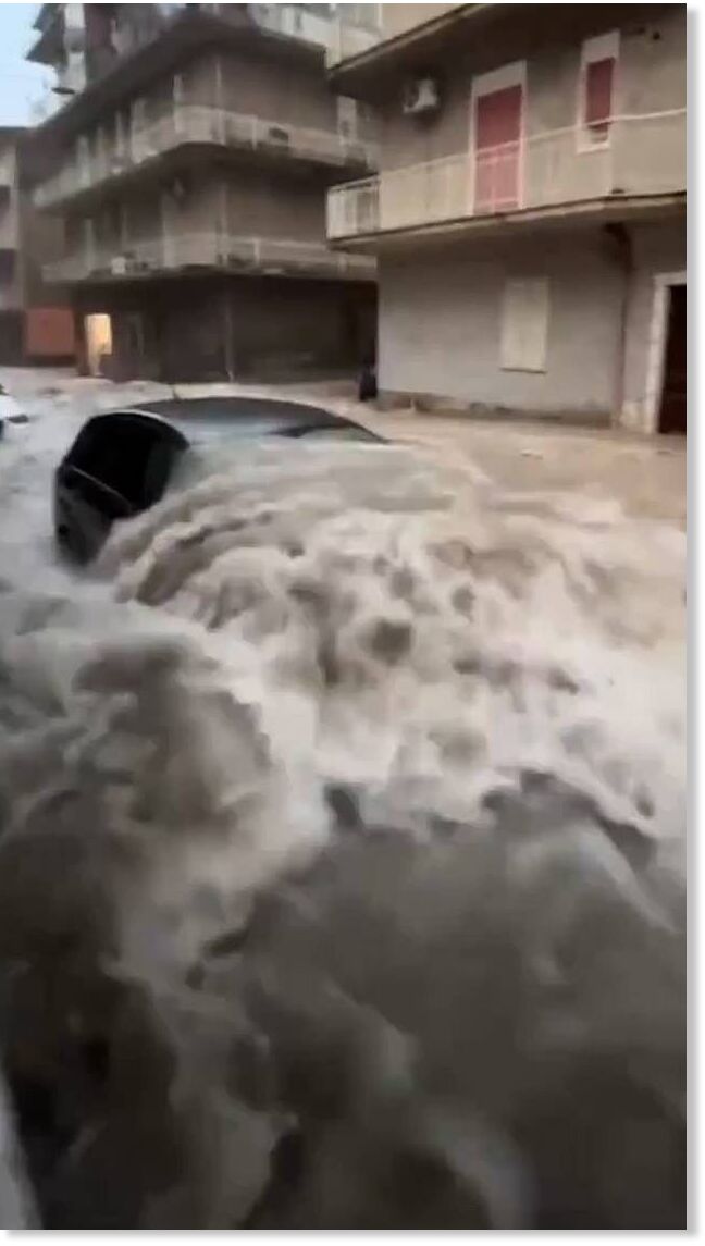 Cars floated down village streets and water engulfed vehicles