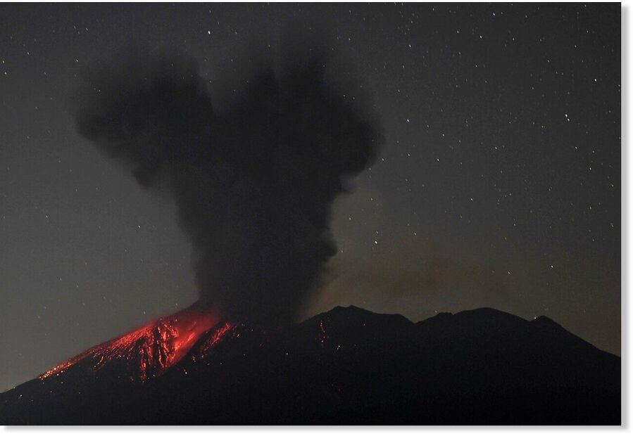 Photo taken on Nov. 16, 2025, from an unmanned fixed-point camera in Tarumizu, Kagoshima Prefecture, shows Sakurajima volcano erupting.