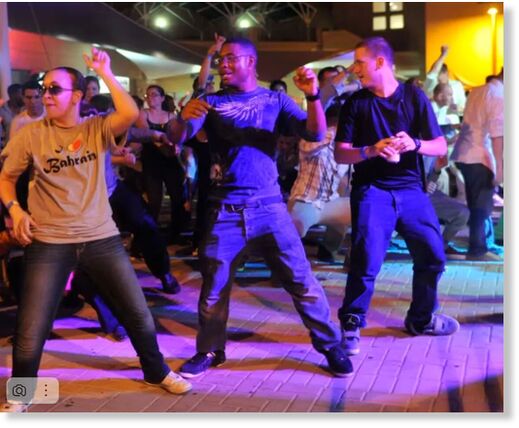 Sailors and Marines dancing at Naval Support Activity Bahrain