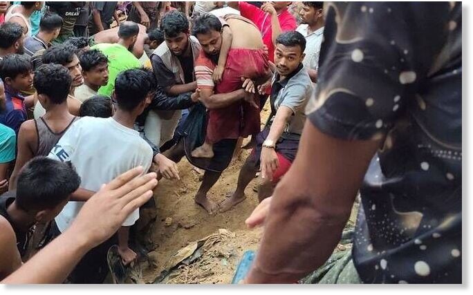 Klikni za povećanje Community members rescue survivors of a landslide that hit a madrassa in a Rohingya refugee camp, killing eight children in Cox’s Bazar, Bangladesh, July 8, 2026.